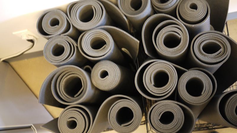 Rolled mats stacked and ready for class