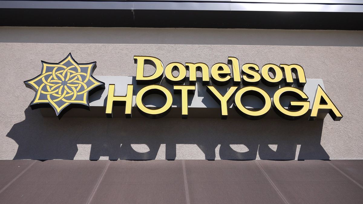 The Donelson Hot Yoga sign on the front of the building